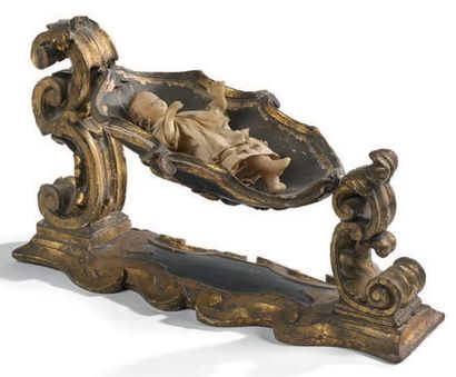 null Berceau de santon baroque en bois peint, doré et sculpté à motifs d'acanthe.
Travail...
