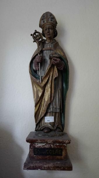 null Statuette de Saint Nicolas en bois sculpté polychrome et doré.

Haut. 64 cm