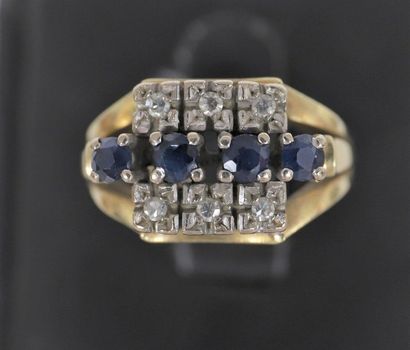 null Ring 

In 14k gold centered with 4 sapphires, between two rows of 3 brilliant-cut...