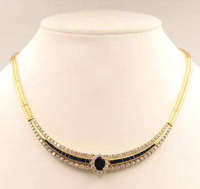 null Necklace 

Yellow gold necklace set with sapphires and diamonds, centered with...