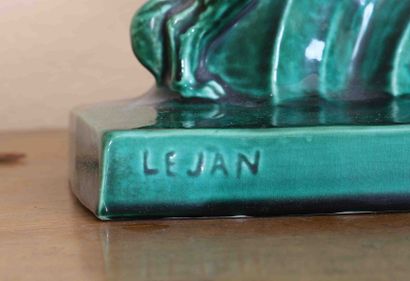 null LEJAN - Woman with a greyhound 
Group in green earthenware, signed on the base....