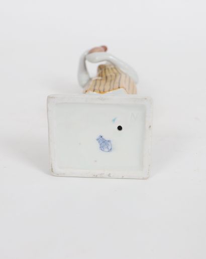 null Woman with a coffee pot 
Stamp under the base 
20th century period 
Dimensions:...