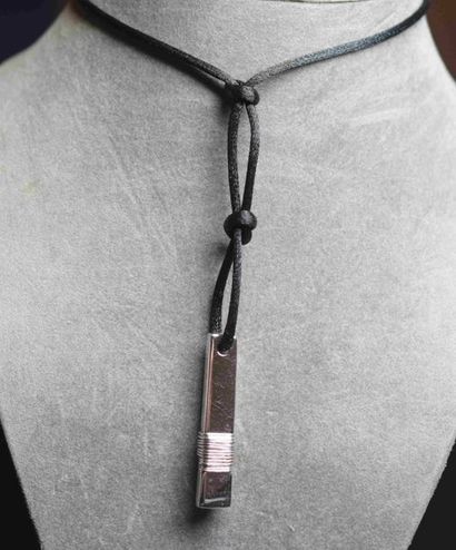 null PENDANT slender solid silver pendant on its cord.