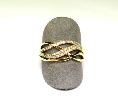 null Yellow gold ring with 4 intertwined rushes, two of which are set with imitation...