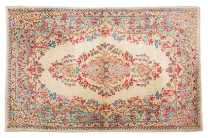 null Thin KIRMAN with beige field and large central medallion with pastel-coloured...