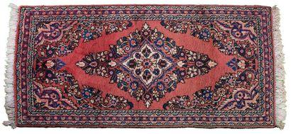 null SAROUK with pink field with very broad central medallion with flowered sprays...