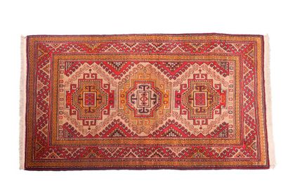 null KAZAK with beige field decorated with three crenellated geometric medallions...
