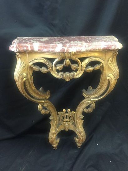 null CONSOLE out of carved and gilded moulded wood decorated with openwork shells,...