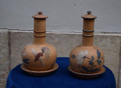 null SCREAM. RARE PAIR OF COVERED BOTTLES and their saucers in fine earthenware with...