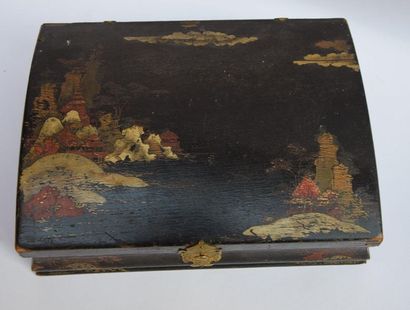 null Wooden box painted black with rocky landscape decoration with pagodas. Curved...