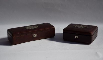 null BOTTLE OF TWO LEATHER BOXES, red upholstered interior. Decorated on the top...