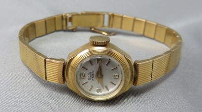null Unic

 Montre Bracelet de Dame

 en or à 750°/00, boîtier rond, cadran blanc,...