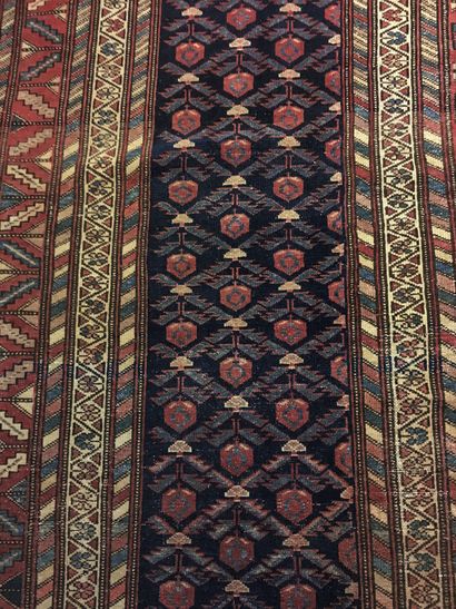 null Caucasian carpet, weft, warp and wool velvet, midnight blue background with...