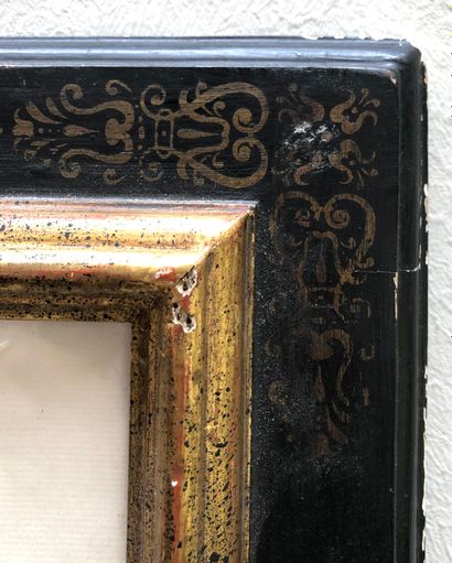 null TWO FRAMES in blackened wood with gilded painted decoration of garlands at the...