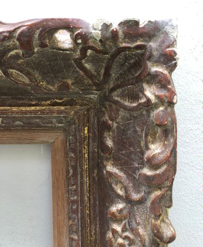 null A carved and gilded wood and stucco frame decorated with acanthus leaves at...