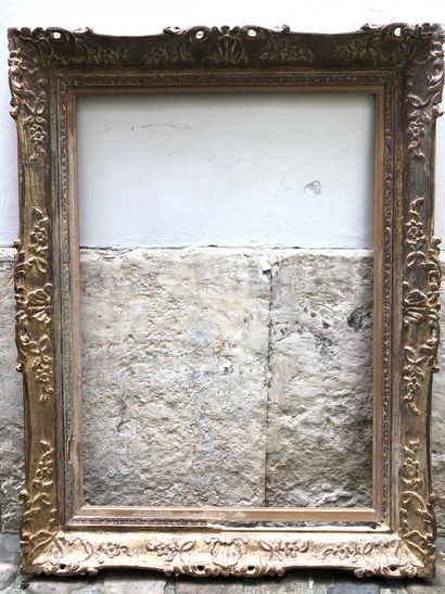 null A carved and gilded wood and stucco frame decorated with acanthus leaves at...