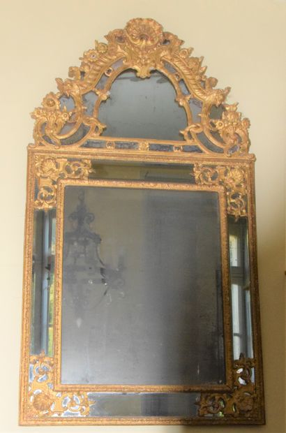 A large moulded, carved and gilded wood MIRROR,...