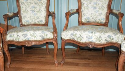 null Suite of FOUR ARMCHAIRS, two of them XVIIIth century, in natural wood, moulded...
