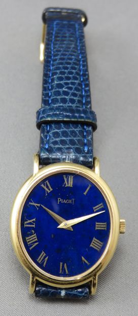 null Piaget

 Ladies' wristwatch

 in 750°/00 gold, oval in shape, the dial in lapis...