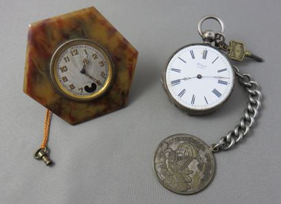 null Lot composed of

 a silver pocket watch "Poligné à Vitré", mechanical movement...