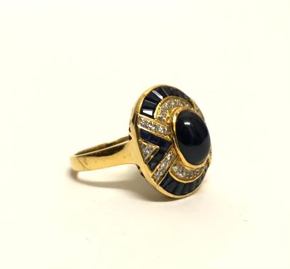 null Yellow gold ring 18K (750 thousandths) set closed with an oval sapphire cut...