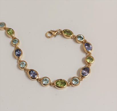 null Bracelet in vermeil (925 thousandths) set closed with peridots, blue topazes...