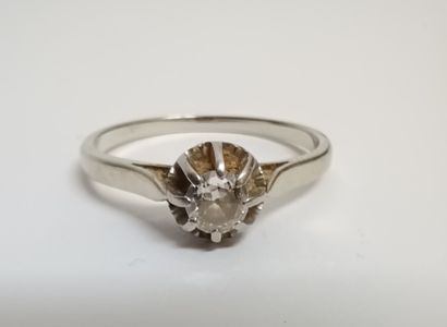 null 18K (750 thousandths) white gold solitaire set with a 0.15 ct old cut diamond....