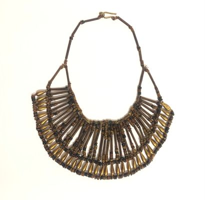 null TWO NECKLACES, one made of wooden beads; - the second with several rows of black...