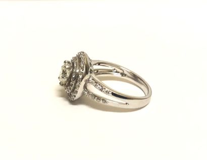 null Ring in 14K (585 thousandths) white gold alloy centered on a brilliant-cut diamond...