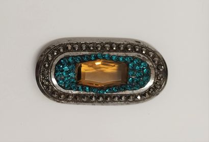 null BRACKET centered with a stone imitating citrine in a surround of rhinestones....