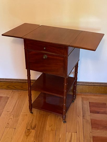 null Small mahogany table with shutters, drawer and two trays. Uprights ringed ended...