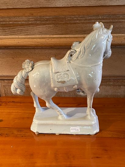 null Statuette of a prancing horse resting on a rectangular base in white earthenware....
