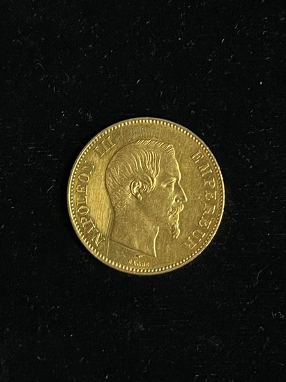 null Une pièce en or de 100 francs Napoléon III (usures)