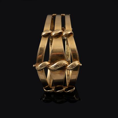 null Cuff bracelet in gold 750°/00. with three strands in fall, semi rigid articulated,...