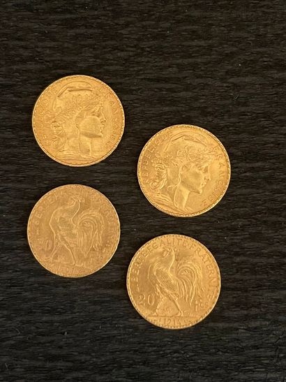 Quatre pièces de 20 francs or (usures). Poids :...