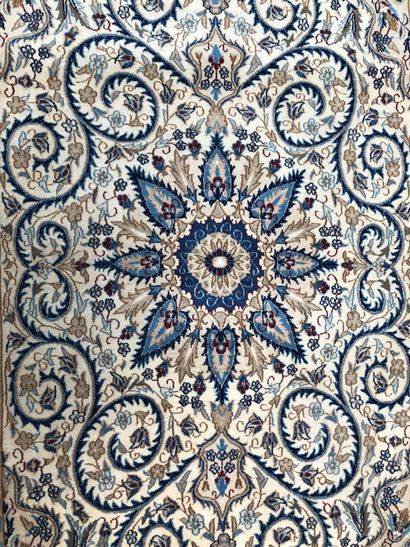 null IRAN, Persia. Naïn wool carpet decorated with floral scrolls on a beige background,...