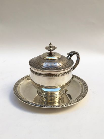 null Covered cup and its saucer in silver decorated with friezes of laurel, crossed...