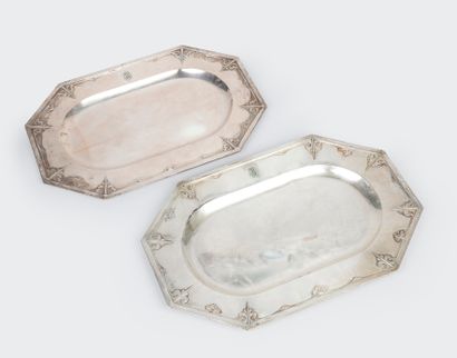 null Two rectangular eight-sided silver dishes with monogrammed decoration in relief...