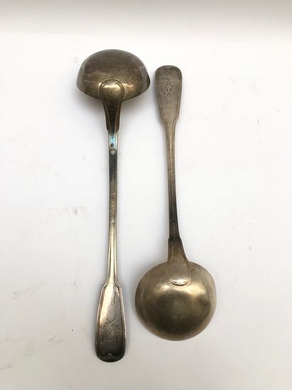 null Silver lot including a ladle model with a monogrammed crest topped by a ribbon...