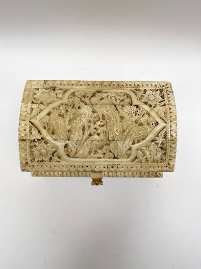 null Quadrangular box with curved lid in bone carved in high relief of vegetation,...