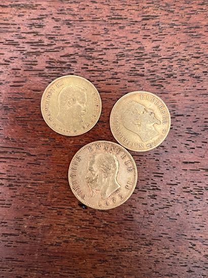 null Lot including: two 10 Franc gold coins (worn), and one 20 Lira Italian coin...