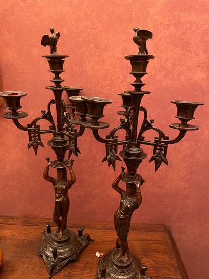 null Pair of metal candelabras with four lights decorated with Egyptians. Height:...