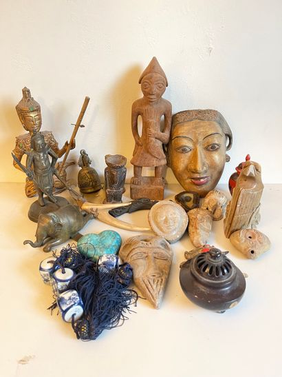 null Lot of travel souvenirs: Balinese mask, wood and stone statuettes, vases, b...