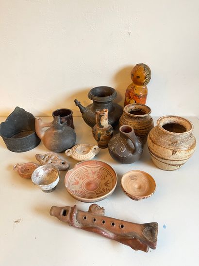 Lot of travel souvenirs: oil lamps, terracotta...
