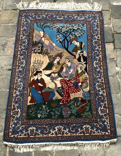null NAIN. Persian carpet in wool and silk 
"Country scene " Several characters are...