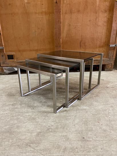 null Suite of three nesting tables in metal, smoked glass tops. XXth century. Dim...