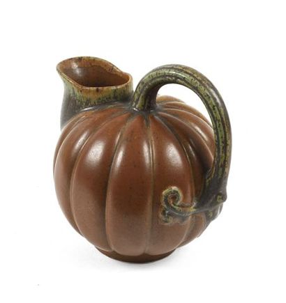 null Pitcher in brown enamelled stoneware in the shape of a coloquint. Take in the...