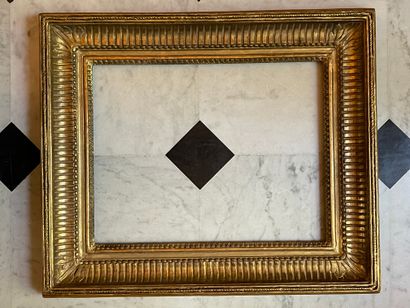 Carved and gilded oak frame with channels,...