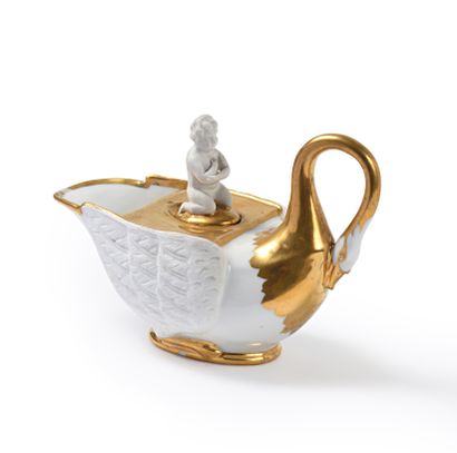 null White and gold porcelain inkwell in the shape of a swan, stopper showing a kneeling...