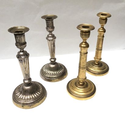 null Lot including two pairs of candlesticks: one in gilt bronze with geometrical...